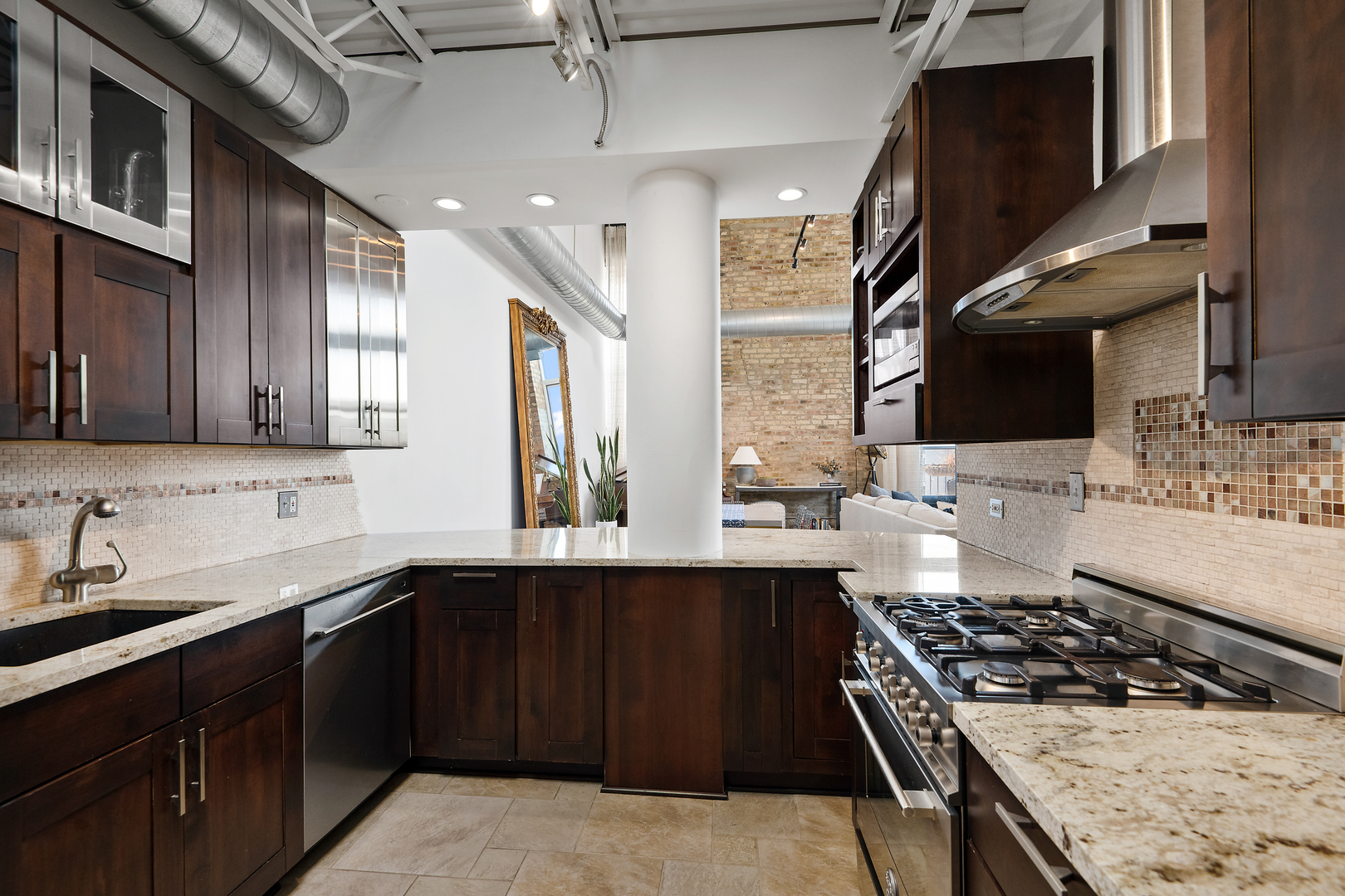 2101 West Rice Street, Unit 308 Chicago, IL 60622 - Photo 10 of 22 a kitchen with stainless steel appliances granite countertop a sink stove and refrigerator