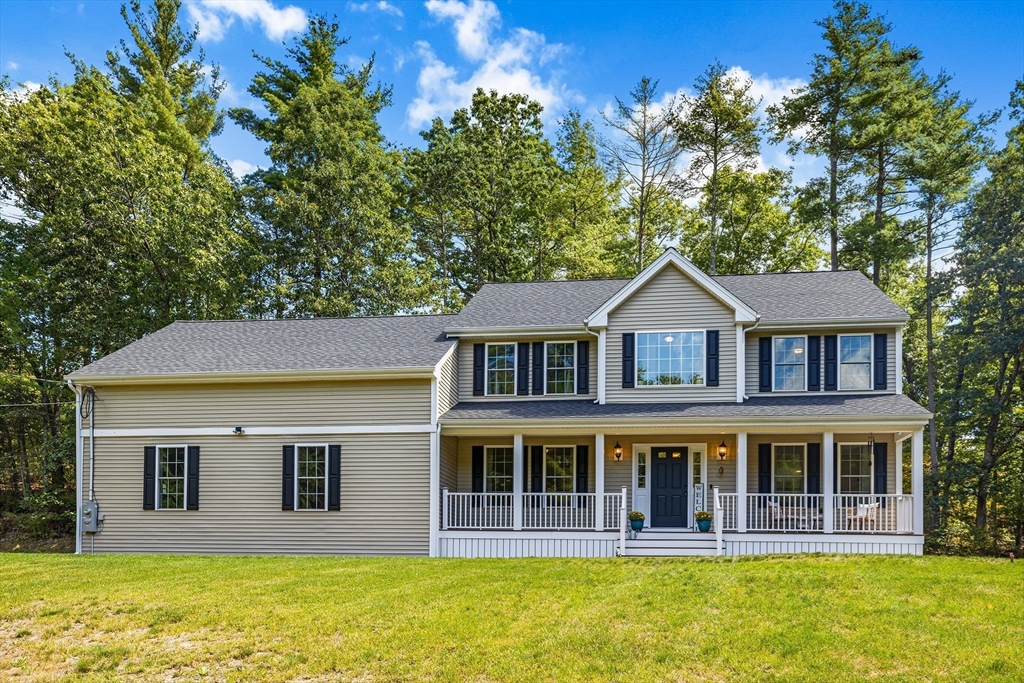 236 Pepperell Road Groton, MA 01450 - Photo 40 of 42 a front view of a house with glass windows and plants