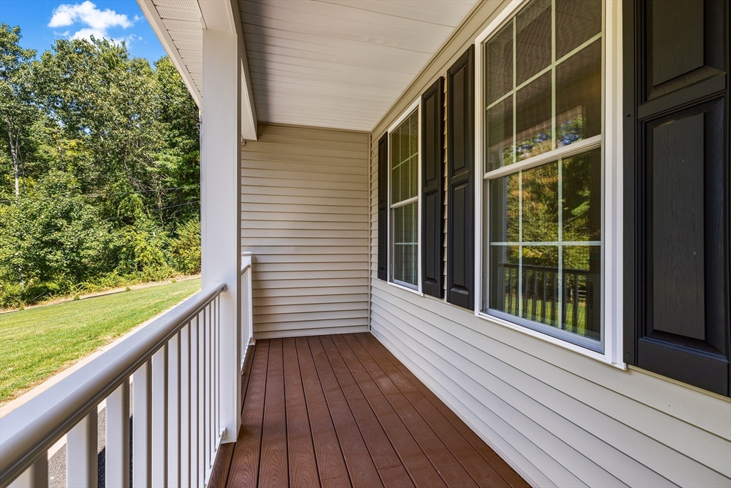236 Pepperell Road Groton, MA 01450 - Photo 5 of 42 a view of a balcony with wooden floor and fence