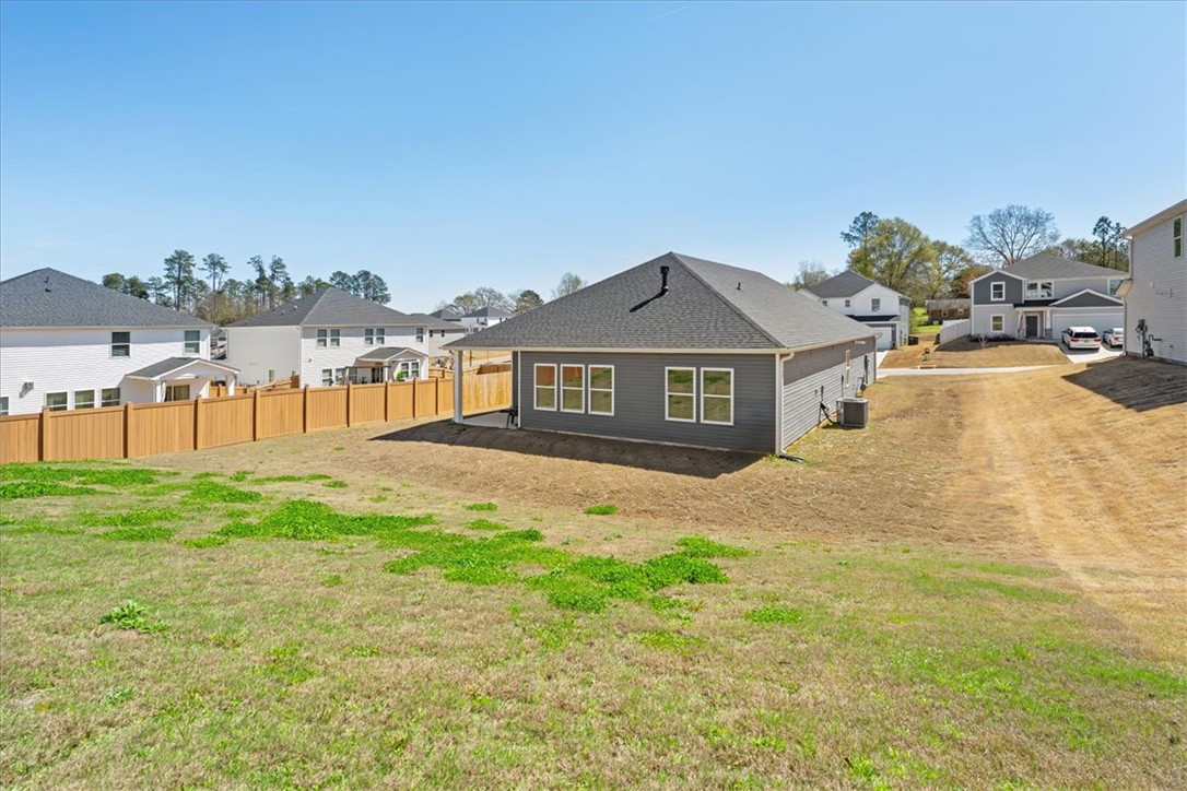 106 Purcell Way Easley, SC 29642 - Photo 38 of 39 This spacious backyard offers ample room for outdoor activities and future landscaping designs.