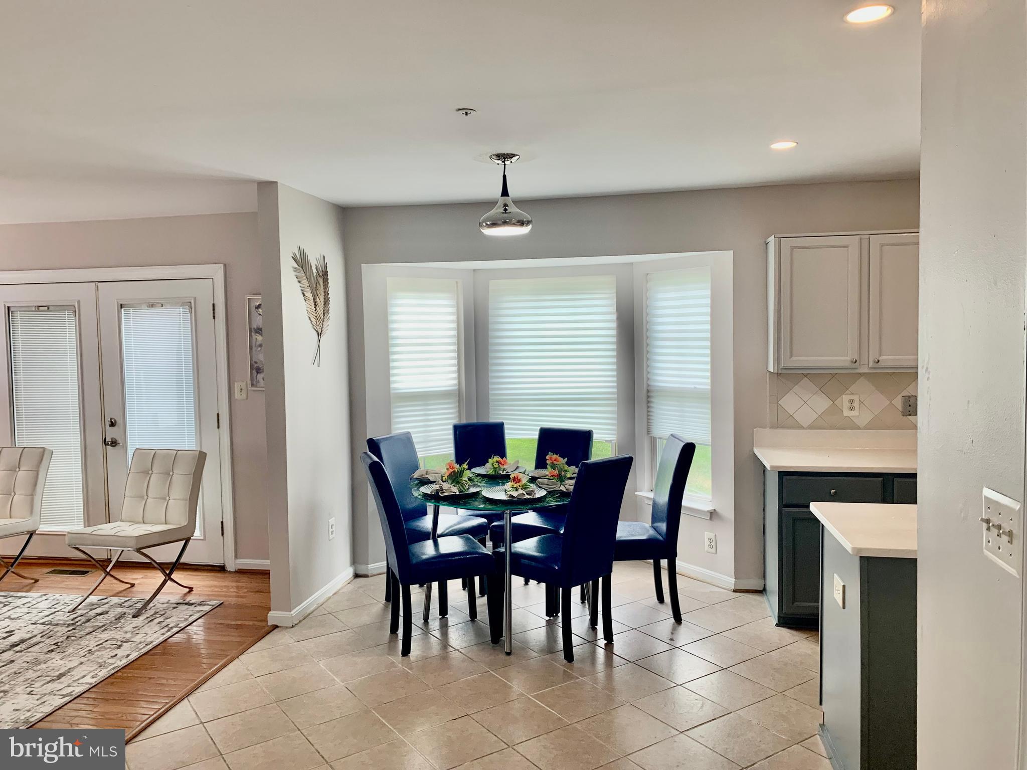2104 Sayan Court Temple Hills, MD 20748 - Photo 16 of 28 a view of a dining room with furniture and window