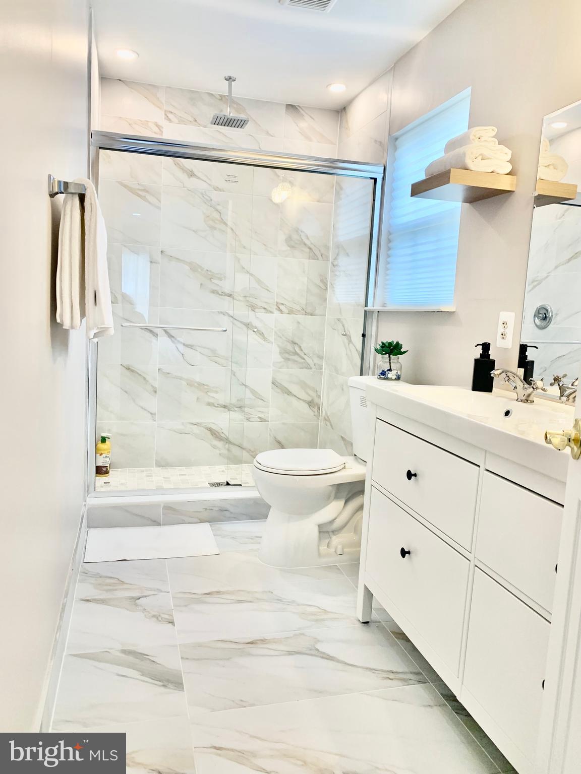 2104 Sayan Court Temple Hills, MD 20748 - Photo 2 of 28 a bathroom with a bathtub and a sink