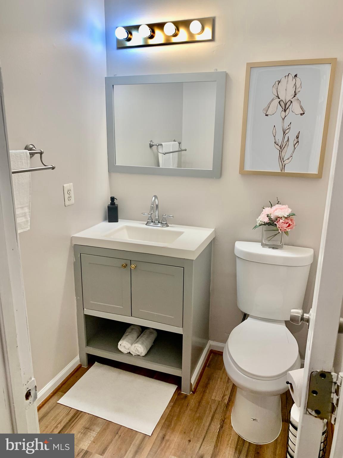 2104 Sayan Court Temple Hills, MD 20748 - Photo 25 of 28 a bathroom with a toilet a sink and mirror