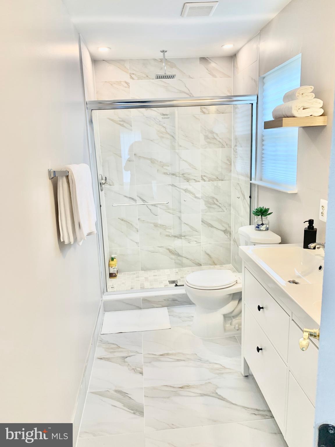 2104 Sayan Court Temple Hills, MD 20748 - Photo 3 of 28 a bathroom with a bathtub and a shower