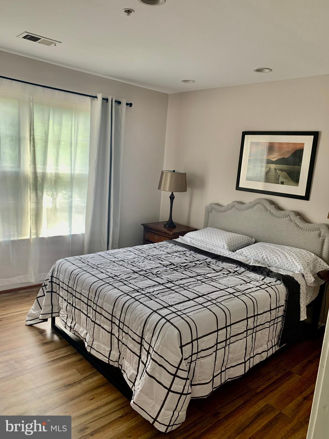 2104 Sayan Court Temple Hills, MD 20748 - Photo 9 of 28 a bedroom with a bed and a large window