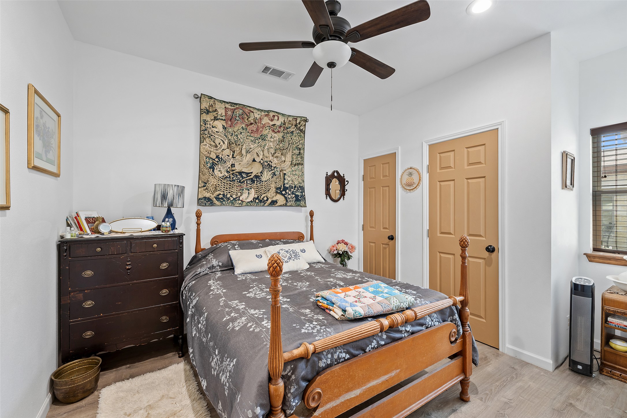 2966 Rm 165 Dripping Springs Dripping Springs, TX 78620 - Photo 23 of 23 Well-lit interior with wood-finish flooring, a ceiling fan, and two paneled doors
