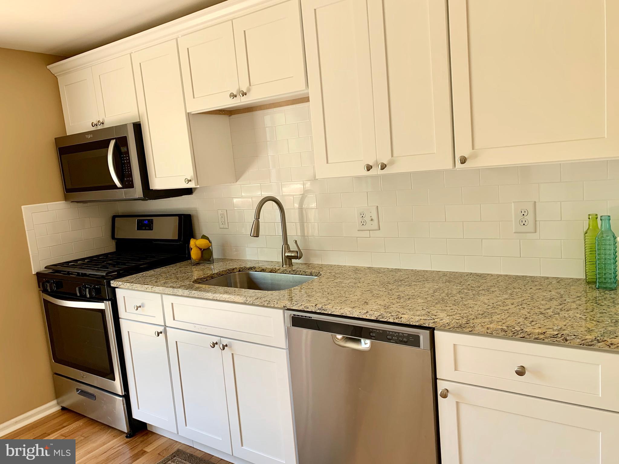 108 West Roland Avenue Maple Shade, NJ 08052 - Photo 8 of 23 a kitchen with appliances a sink and cabinets