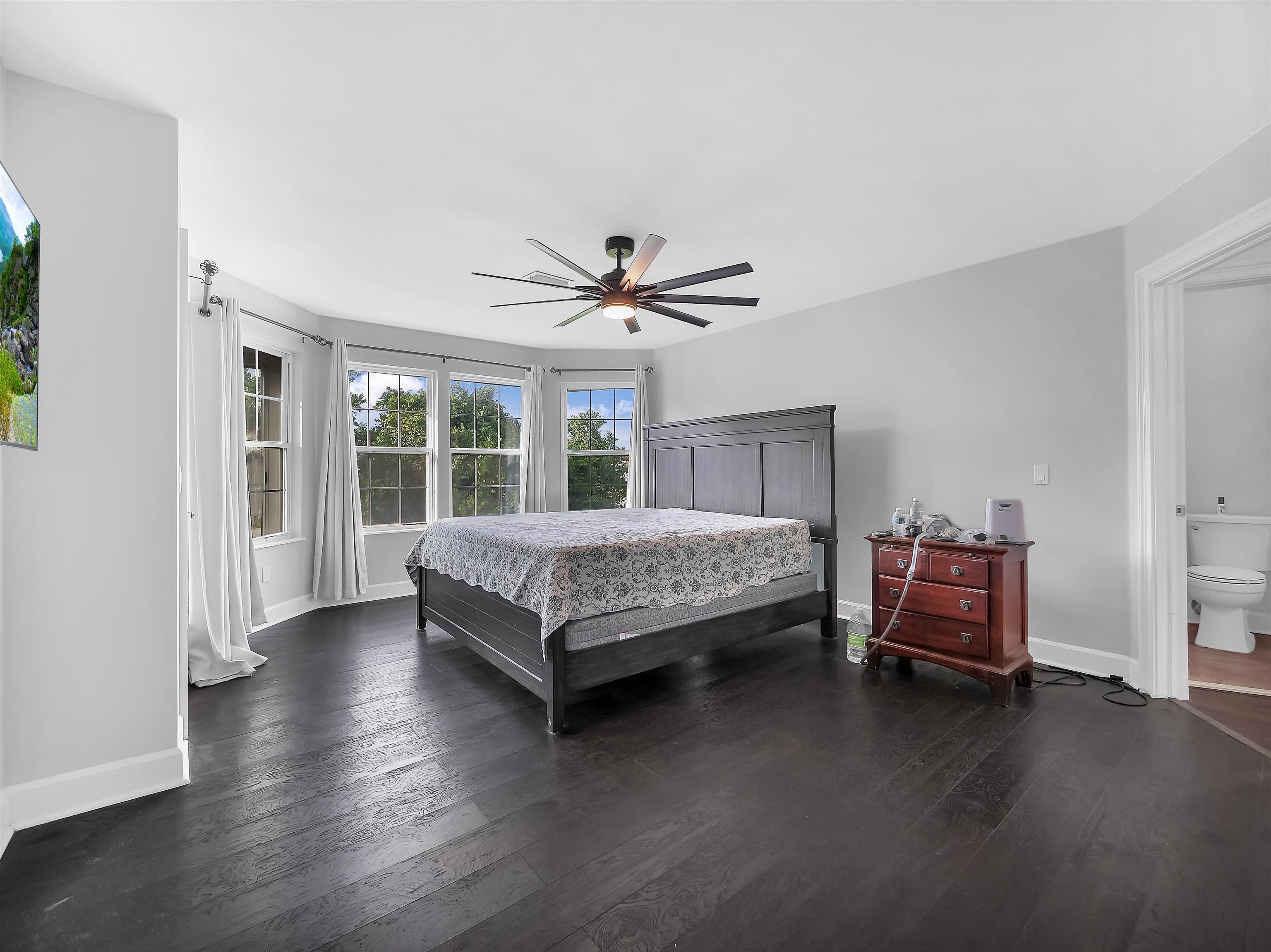 306 Marsh Point Circle St. Augustine, FL 32080 - Photo 4 of 54 a bedroom with a bed and a chandelier