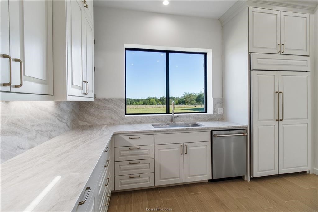 4558 Hicks Lane Bryan, TX 77845 - Photo 13 of 48 a room with a bed and a window