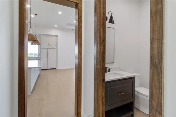 a view of a bathroom from a hallway