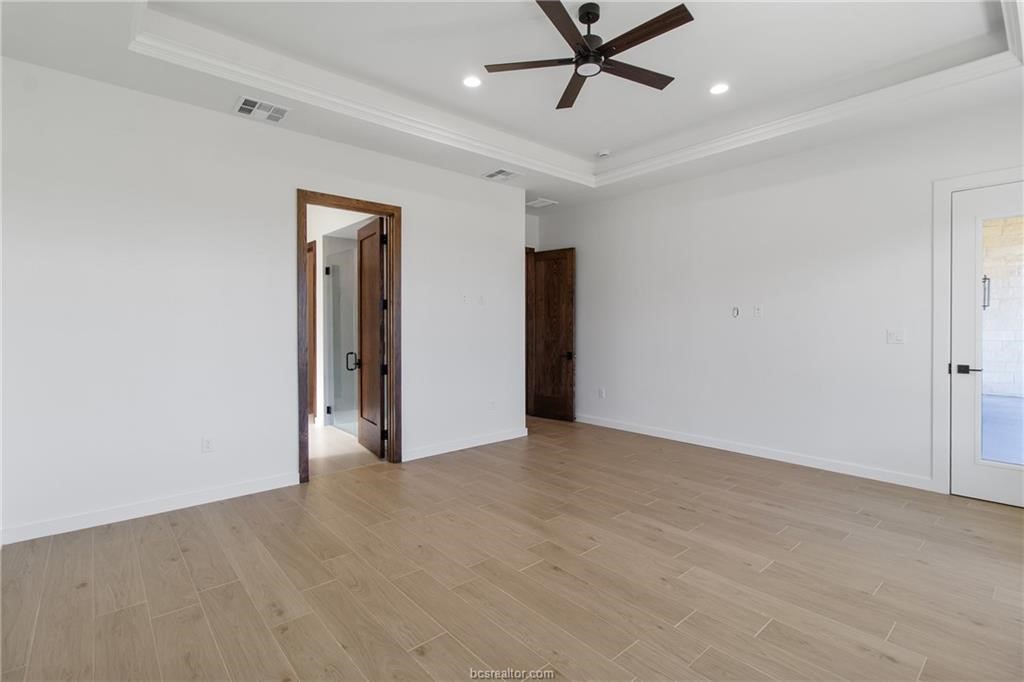 4558 Hicks Lane Bryan, TX 77845 - Photo 28 of 48 a view of a livingroom with a ceiling fan & entryway
