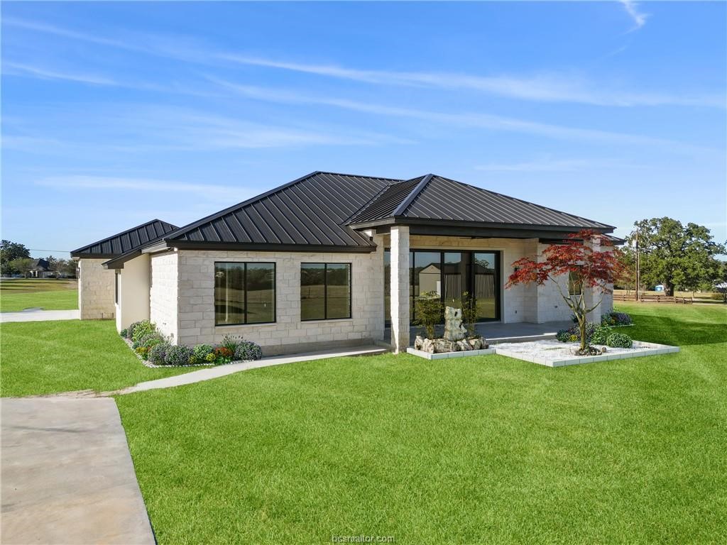 4558 Hicks Lane Bryan, TX 77845 - Photo 38 of 48 a front view of a house with a yard