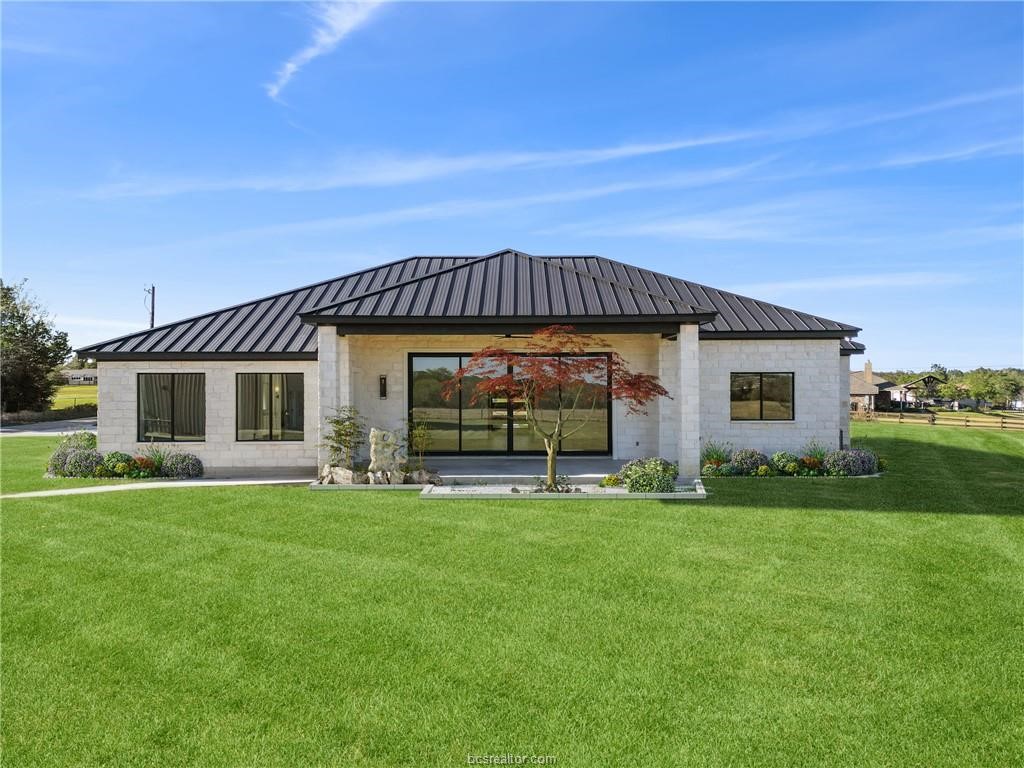 4558 Hicks Lane Bryan, TX 77845 - Photo 39 of 48 a front view of a house with a garden