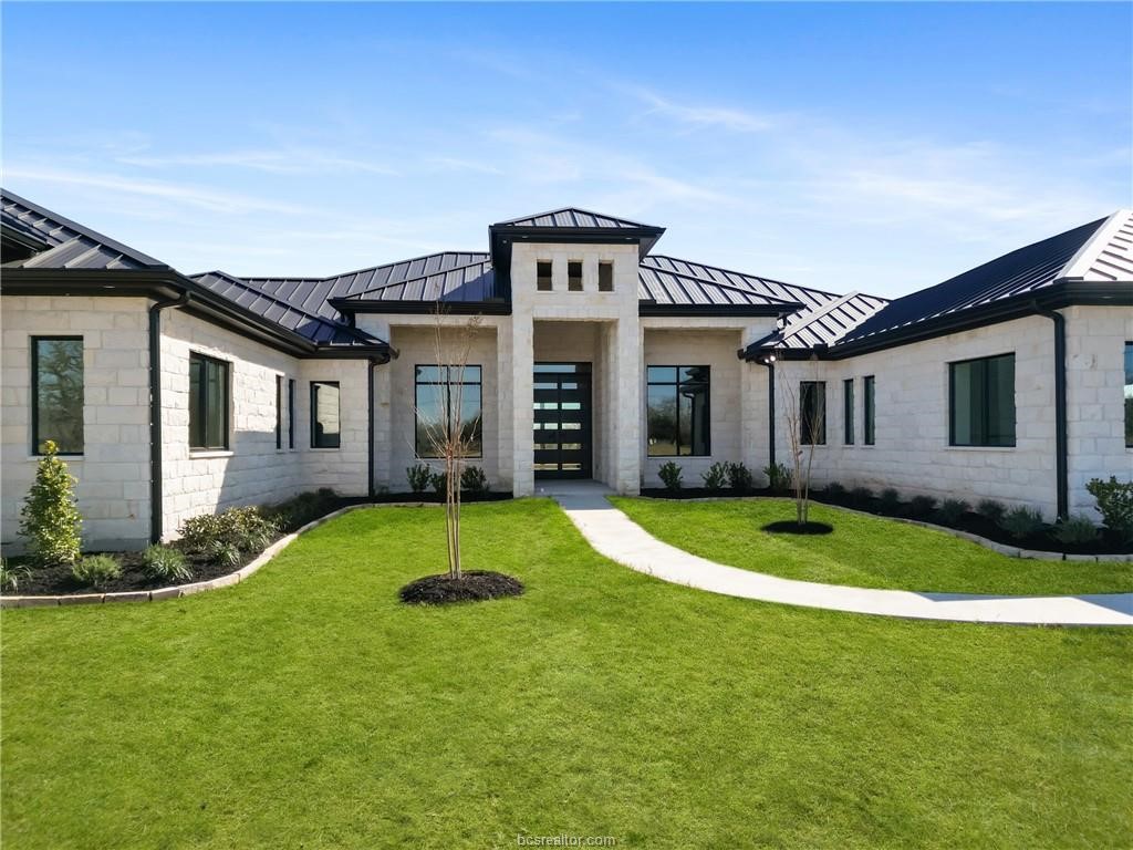 4558 Hicks Lane Bryan, TX 77845 - Photo 4 of 48 a front view of a house with a yard