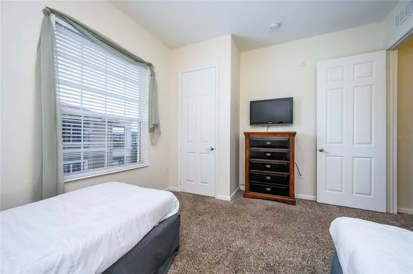a bedroom with a bed and furniture