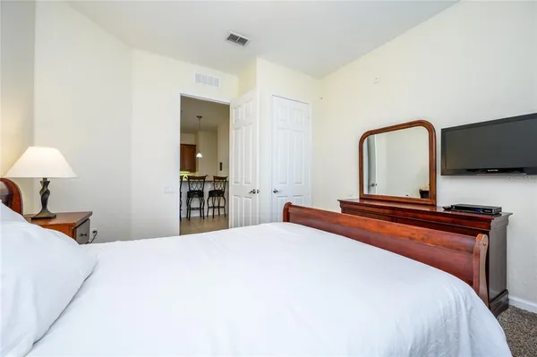 a bedroom with bed and window