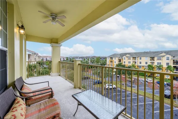 a view of a balcony with furniture