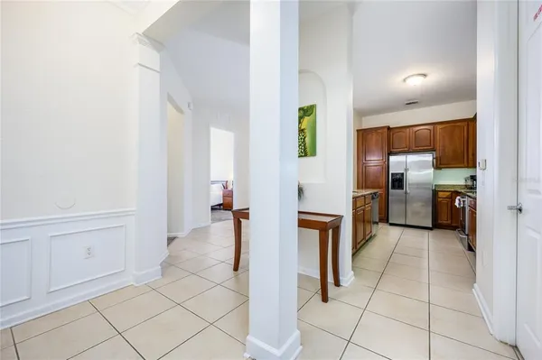 a view of a kitchen with an empty space and a window