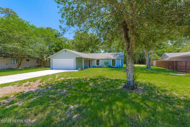 a house with garden in front of it
