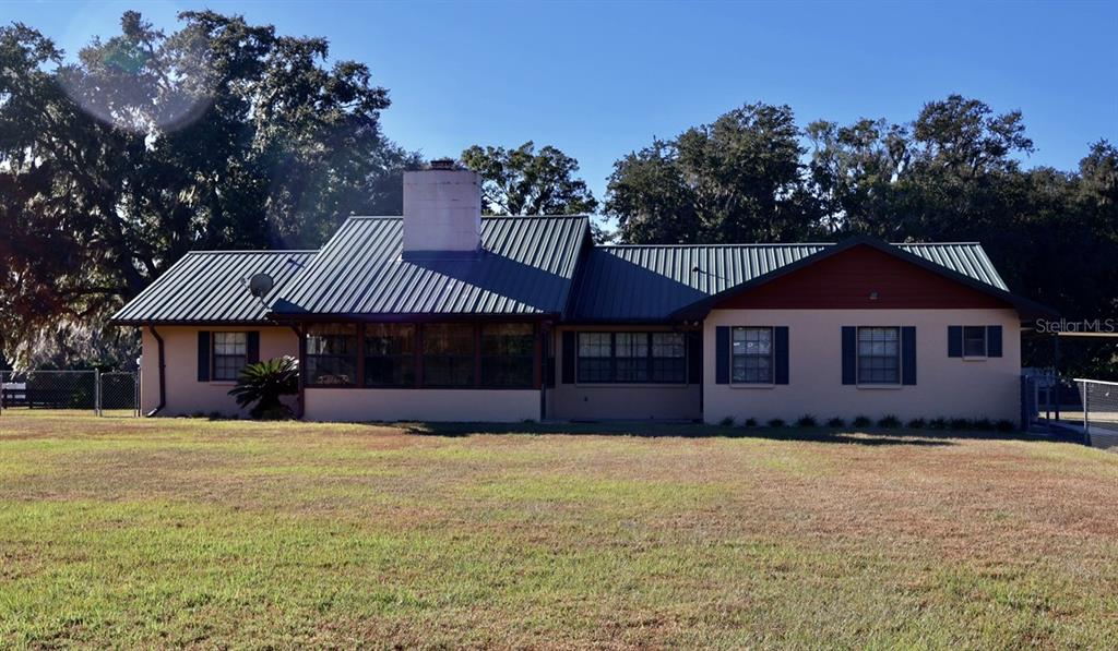 5912 Bailey Road Plant City, FL 33565 - Photo 19 of 30 a front view of a house with a yard