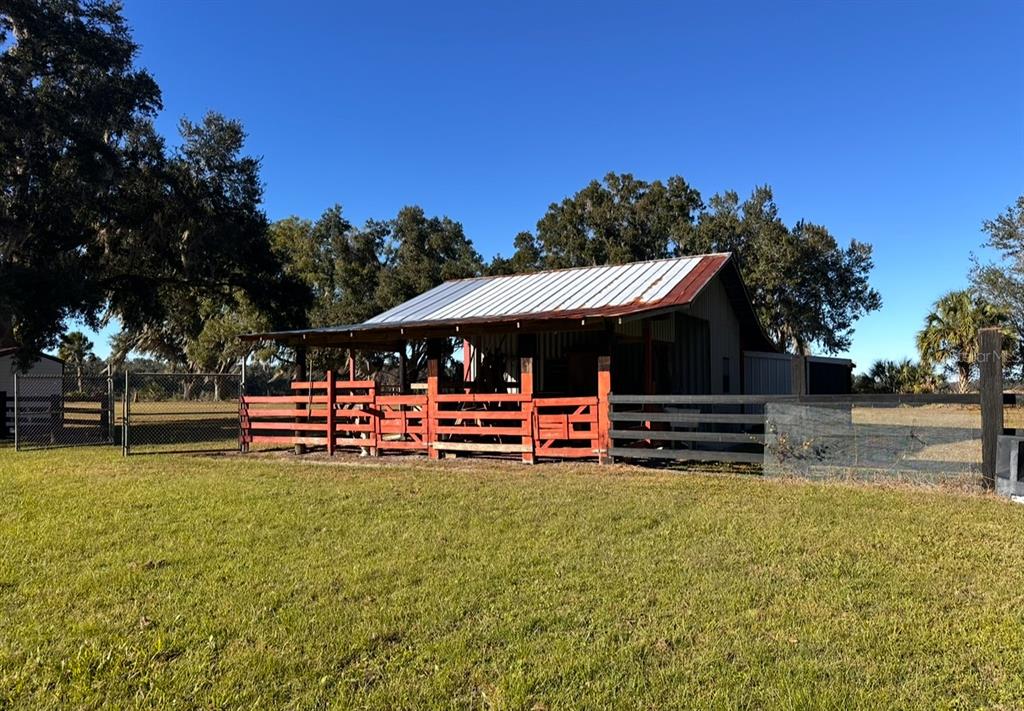 5912 Bailey Road Plant City, FL 33565 - Photo 23 of 30 a view of a house with a yard porch and sitting area
