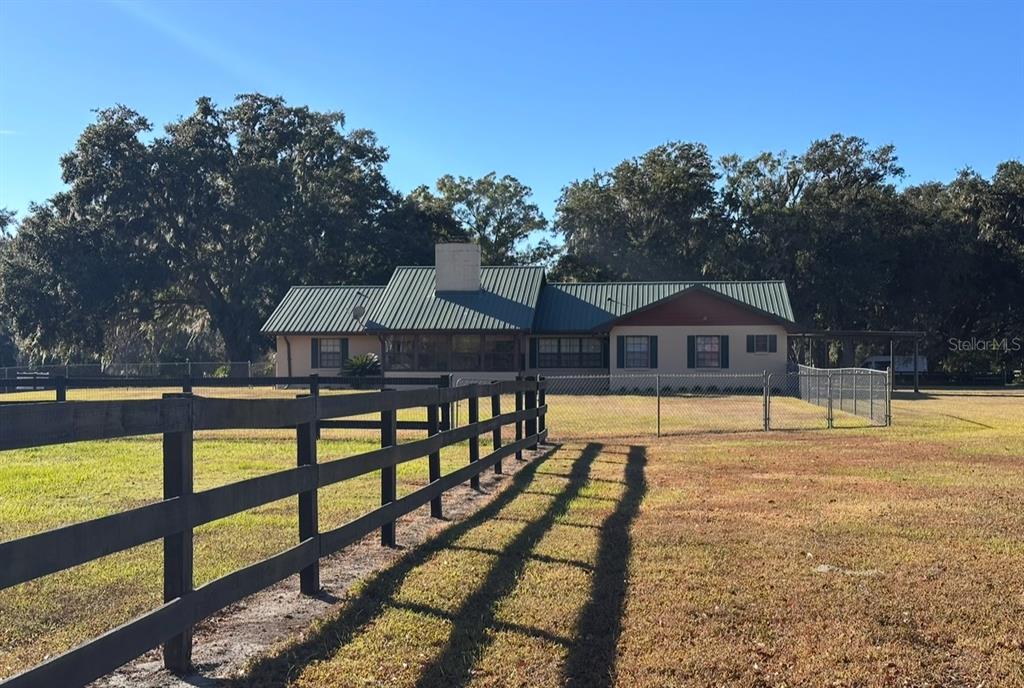 5912 Bailey Road Plant City, FL 33565 - Photo 28 of 30 a front view of a house with swimming pool and porch
