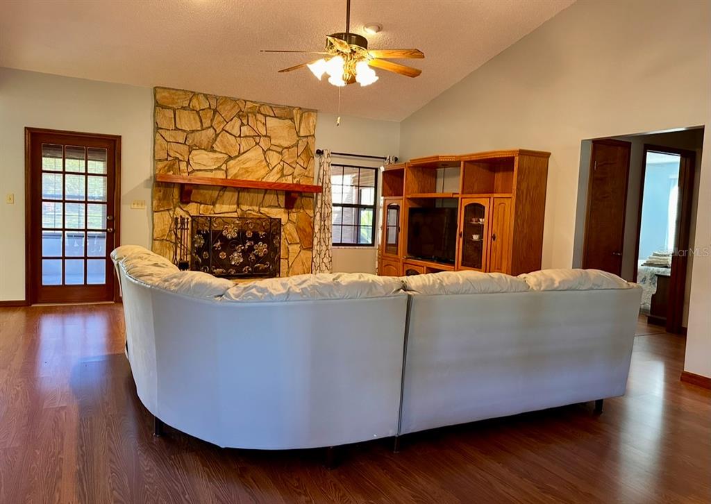 5912 Bailey Road Plant City, FL 33565 - Photo 5 of 30 a living room with furniture and a fireplace