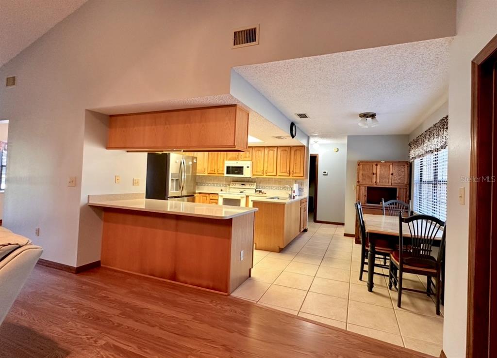 5912 Bailey Road Plant City, FL 33565 - Photo 7 of 30 a kitchen with stainless steel appliances granite countertop a stove and cabinets