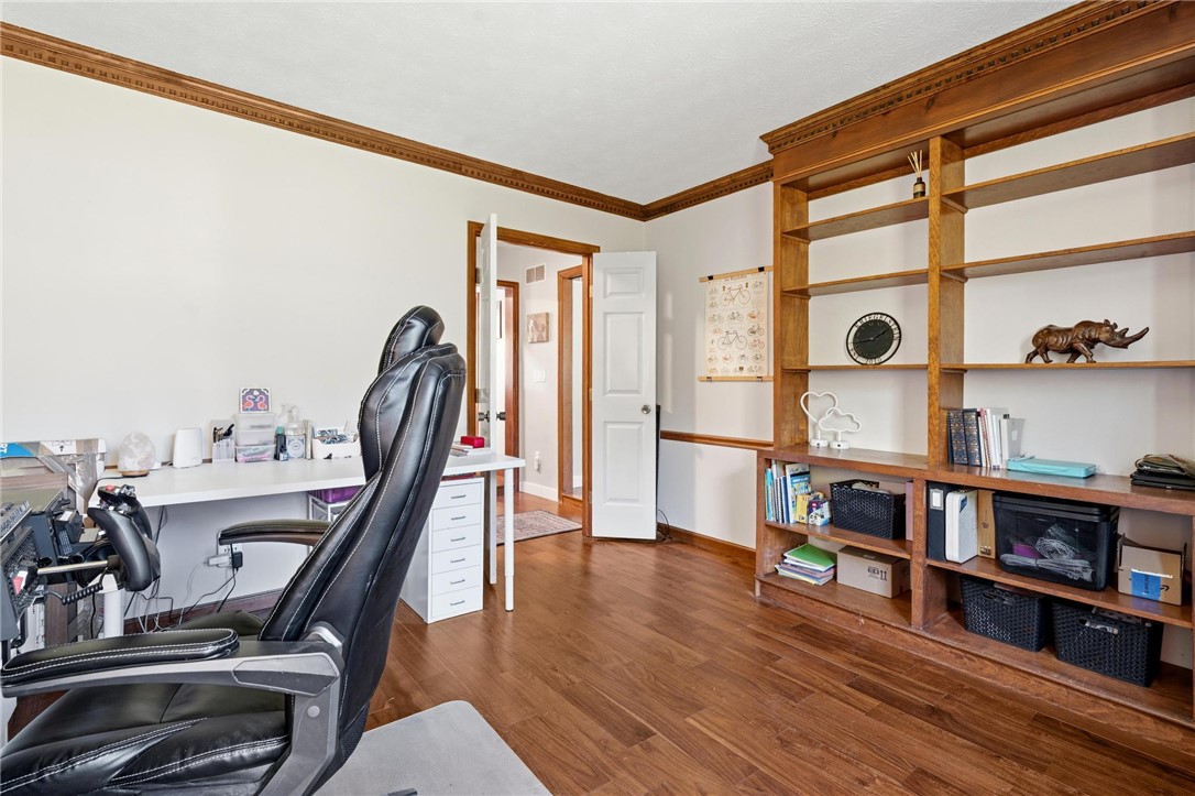 10168 Atchison Road Dayton, OH 45458 - Photo 21 of 44 This versatile space features rich hardwood floors and custom built-in shelving, ideal for a home office.