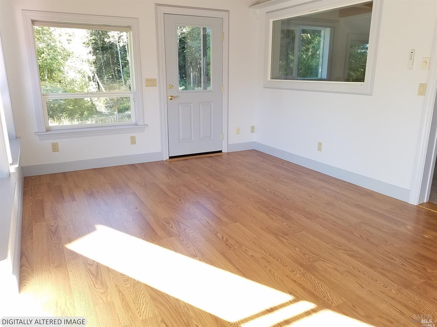 44005 Iversen Road Gualala, CA 95445 - Photo 7 of 18 Entry sunroom- picture taken prior to tenant moving in.