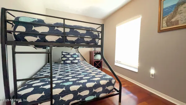 a bedroom with a large window