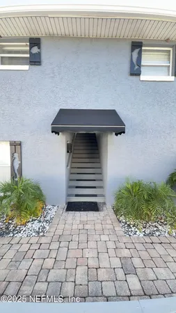 a view of a backyard of the house