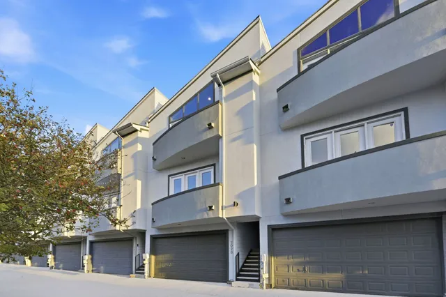 a front view of a building with many windows