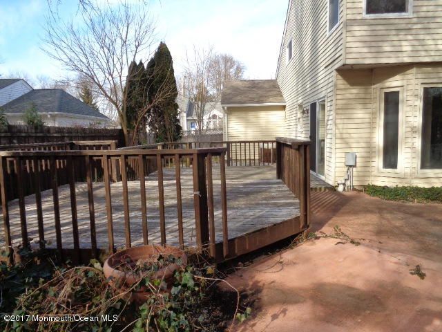 7 Sweet Gum Road Howell, NJ 07731 - Photo 17 of 30 a view of a wooden deck with a bench