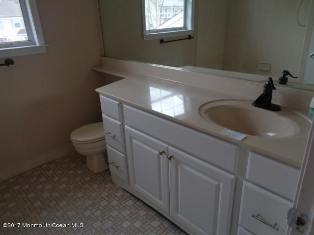 7 Sweet Gum Road Howell, NJ 07731 - Photo 22 of 30 a bathroom with a toilet sink and mirror