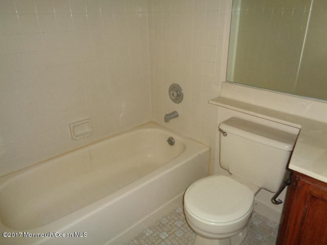 7 Sweet Gum Road Howell, NJ 07731 - Photo 6 of 30 a white toilet sitting next to a bath tub