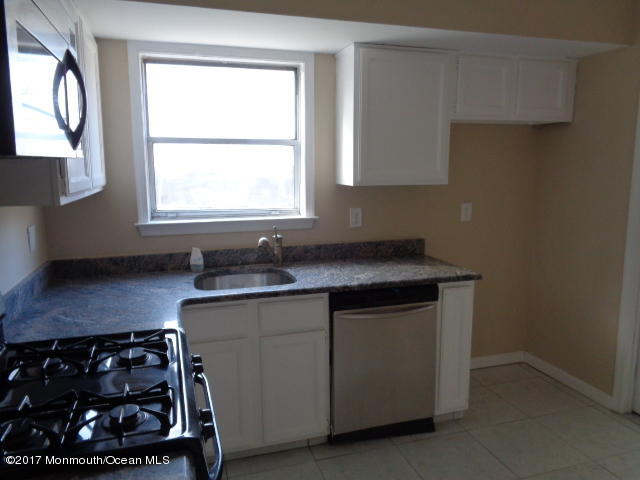 7 Sweet Gum Road Howell, NJ 07731 - Photo 7 of 30 a kitchen with a sink a stove and a window