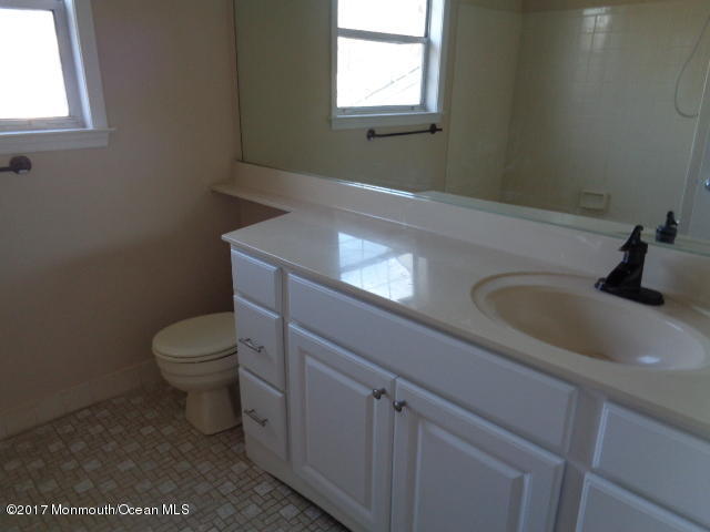 7 Sweet Gum Road Howell, NJ 07731 - Photo 10 of 30 a bathroom with a toilet sink and mirror
