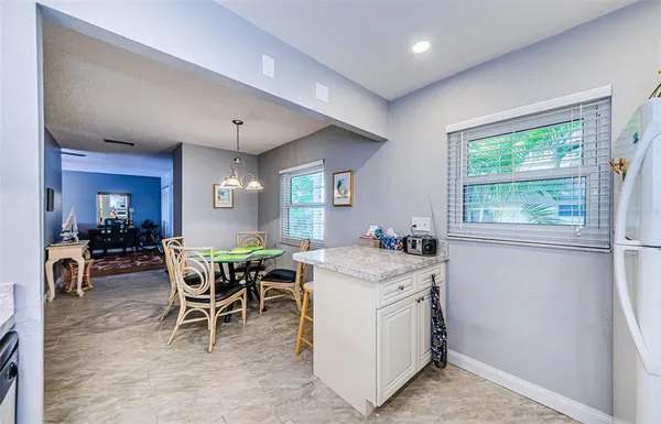 a view of a dining room with furniture window and outside view