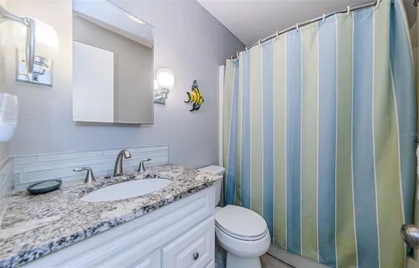 a sign that is on a brick wall