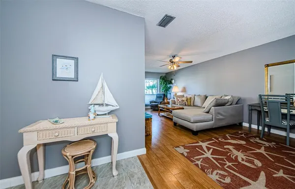 a living room with a couch and a chandelier