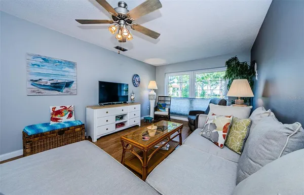 a living room with furniture and a window