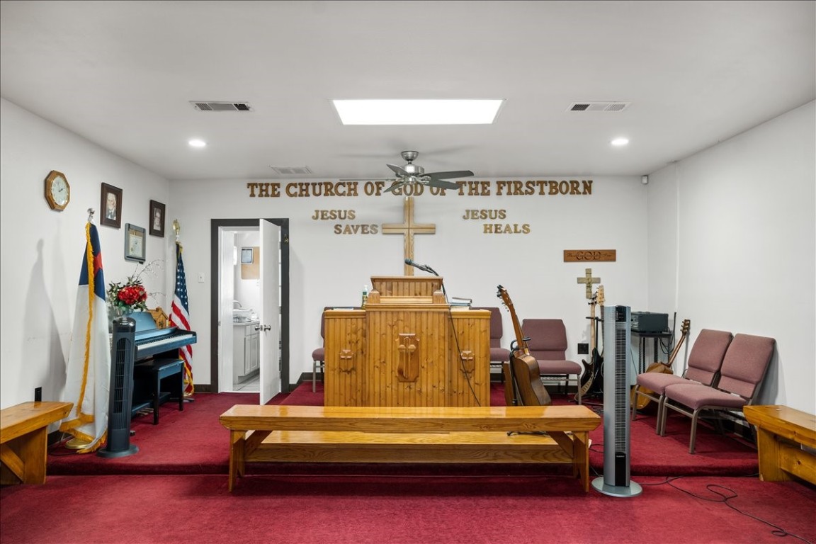 2606 Santa Rosa Street Austin, TX 78702 - Photo 14 of 28 Interior space with ceiling fan, a skylight, and carpet