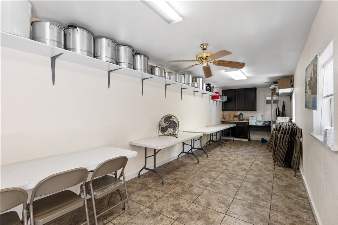 2606 Santa Rosa Street Austin, TX 78702 - Photo 20 of 28 Kitchen featuring light tile patterned floors and ceiling fan