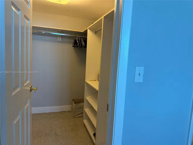 a bathroom with a glass door shower