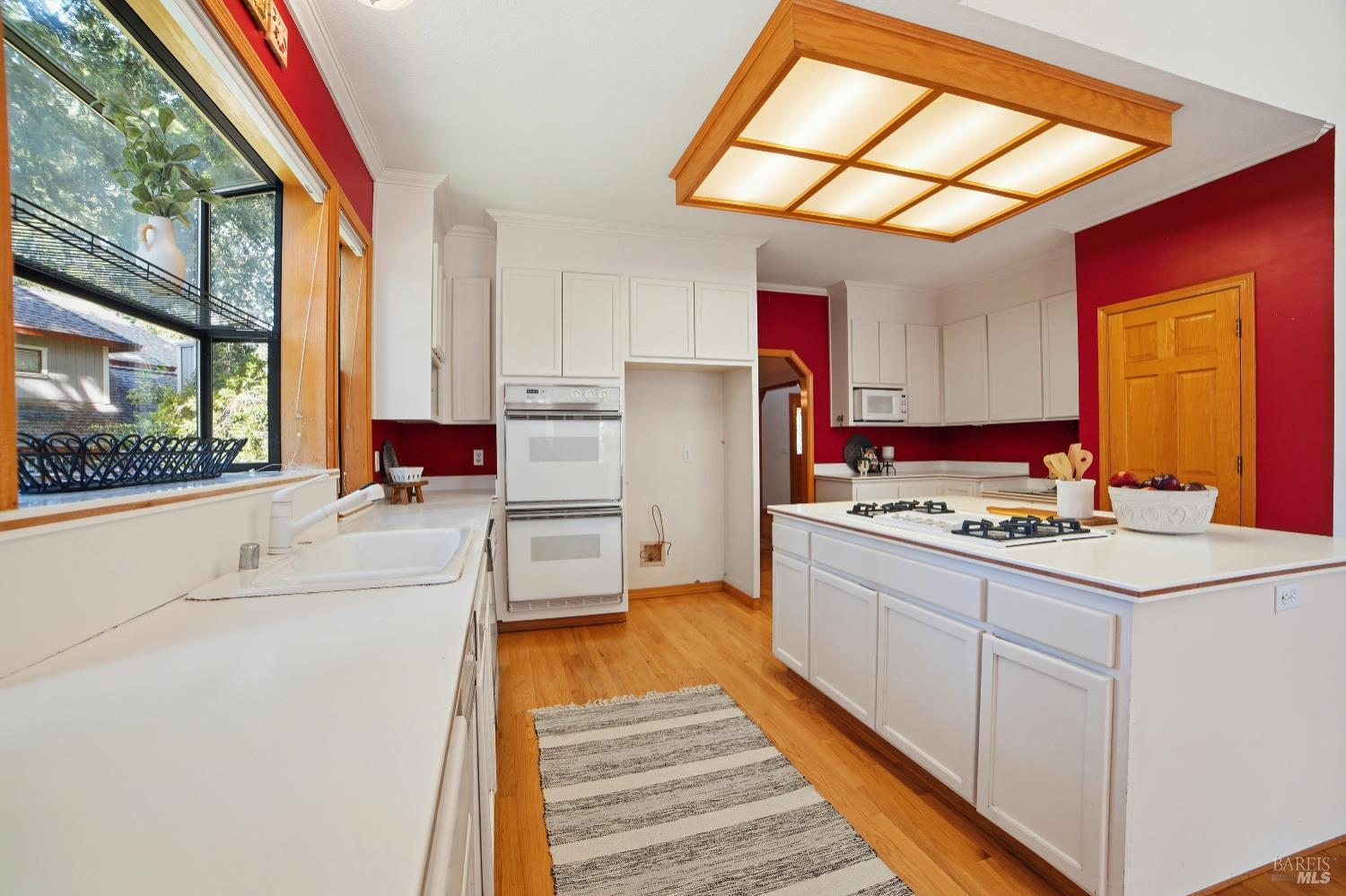 4818 Kieran Court Santa Rosa, CA 95405 - Photo 13 of 51 a kitchen with kitchen island a stove a sink and a refrigerator