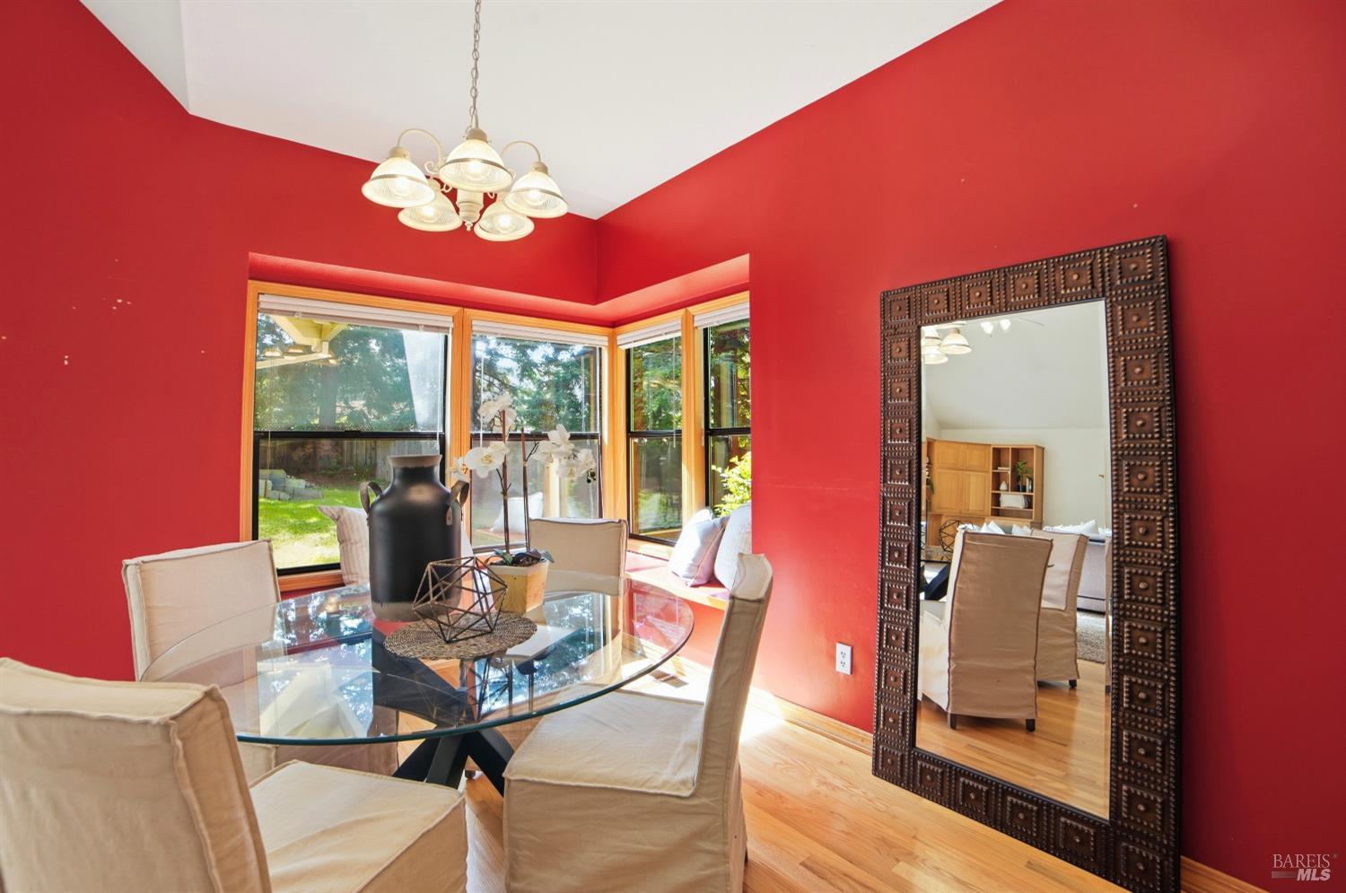 4818 Kieran Court Santa Rosa, CA 95405 - Photo 17 of 51 a dining room with furniture a rug and a chandelier