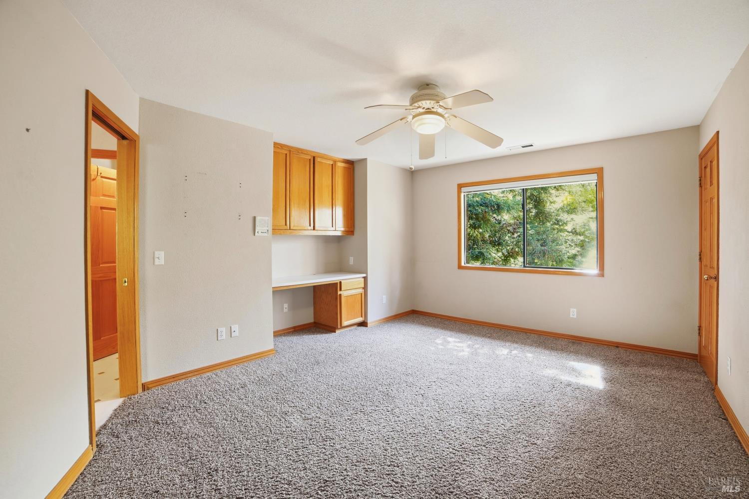 4818 Kieran Court Santa Rosa, CA 95405 - Photo 27 of 51 an empty room with windows and chandelier fan