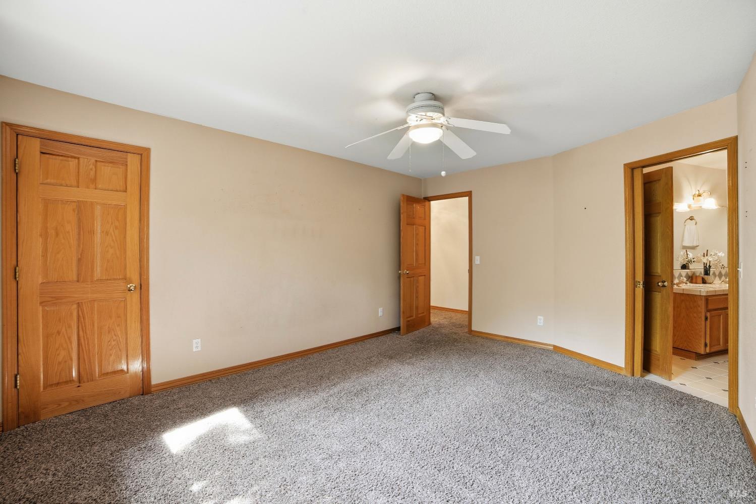 4818 Kieran Court Santa Rosa, CA 95405 - Photo 28 of 51 a view of an empty room with closet and a chandelier fan
