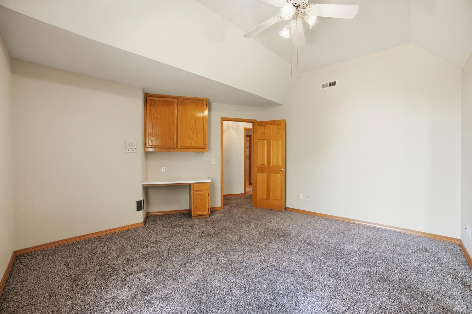 4818 Kieran Court Santa Rosa, CA 95405 - Photo 36 of 51 an empty room with a fireplace and fan